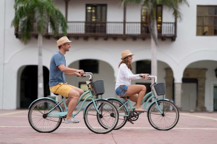 a person riding on the back of a bicycle